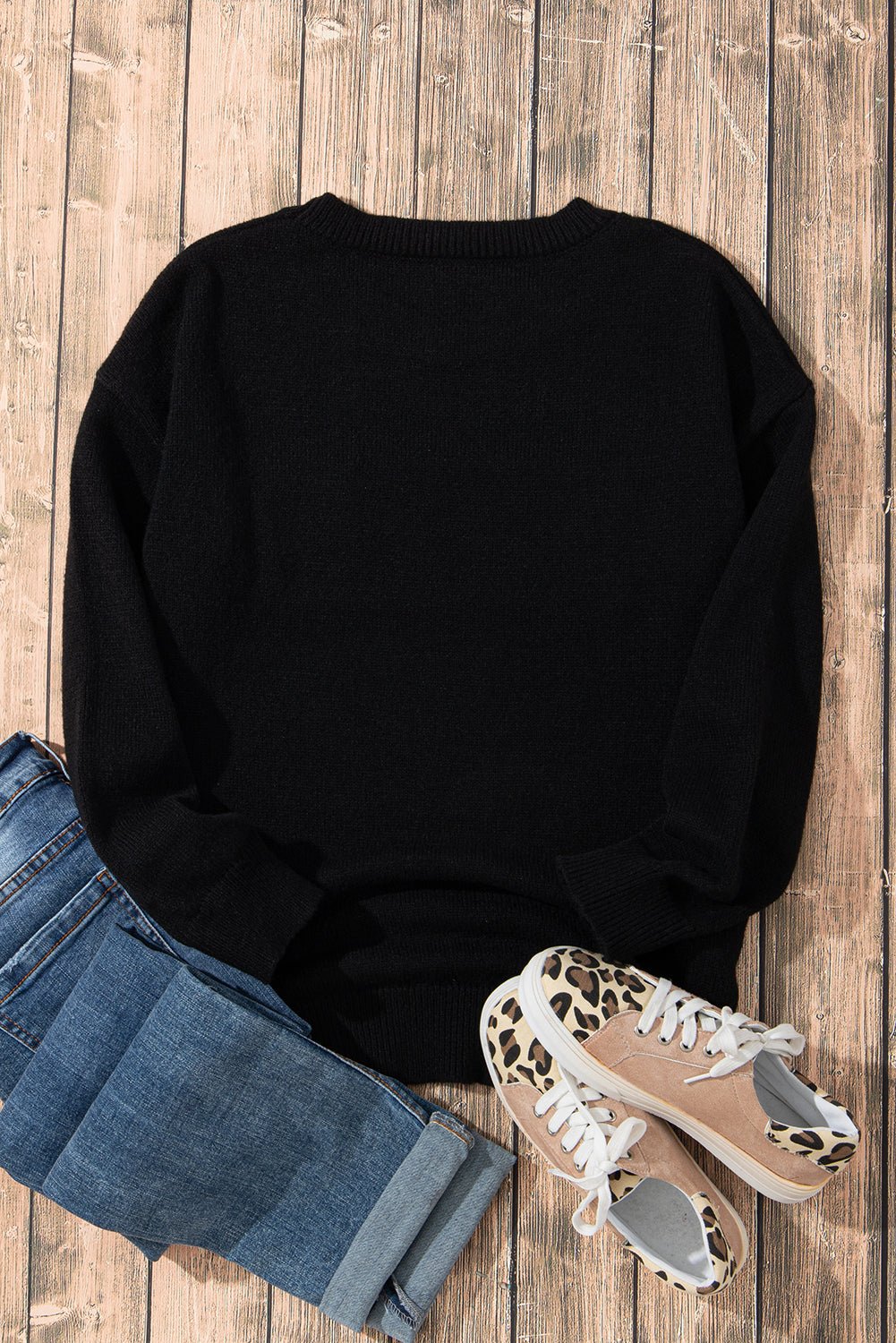 A Black Tinsel Holly Jolly Round Neck Knit Sweater