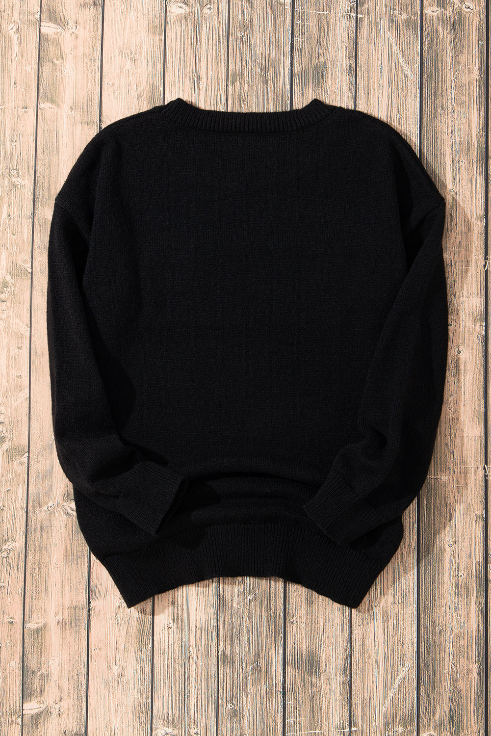 A Black Tinsel Holly Jolly Round Neck Knit Sweater