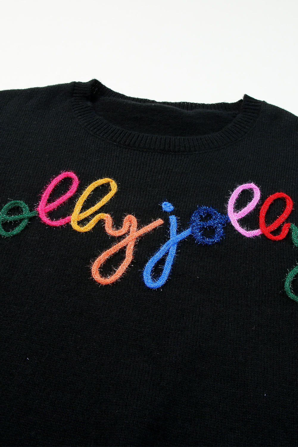 A Black Tinsel Holly Jolly Round Neck Knit Sweater