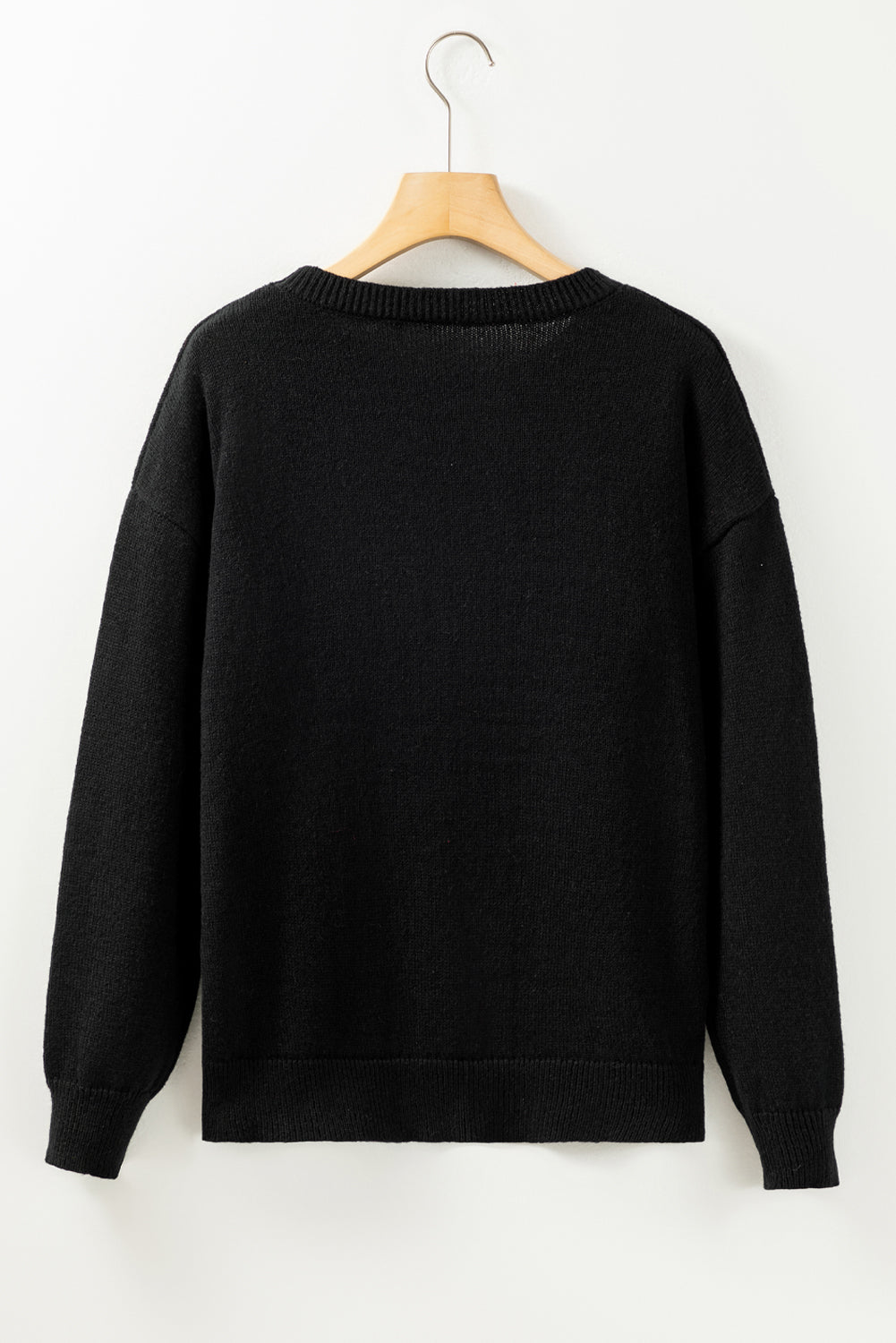 A Black Tinsel Holly Jolly Round Neck Knit Sweater